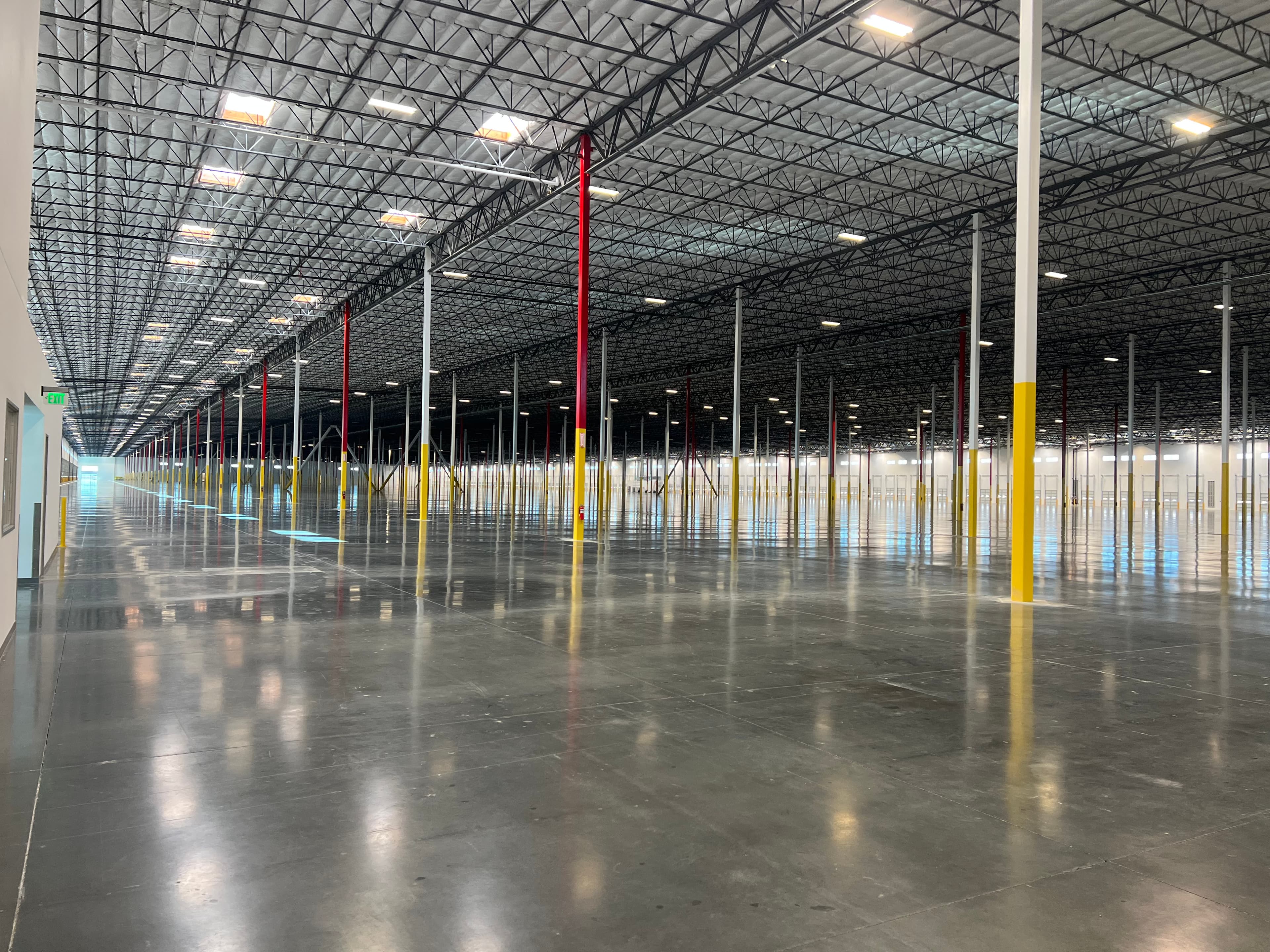 Warehouse interior with polished concrete floor and structural columns